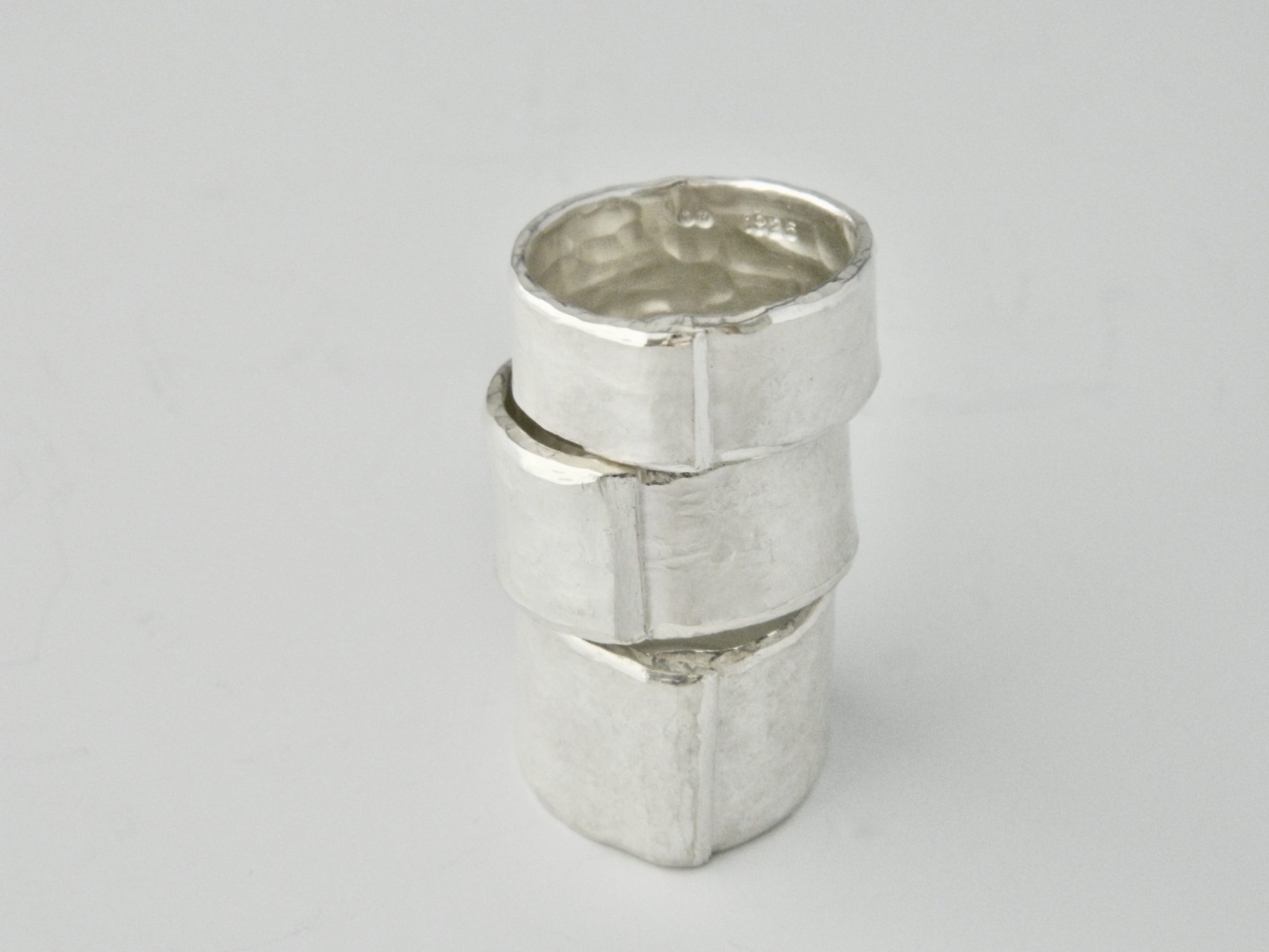 kims signature textured silver overlap rings