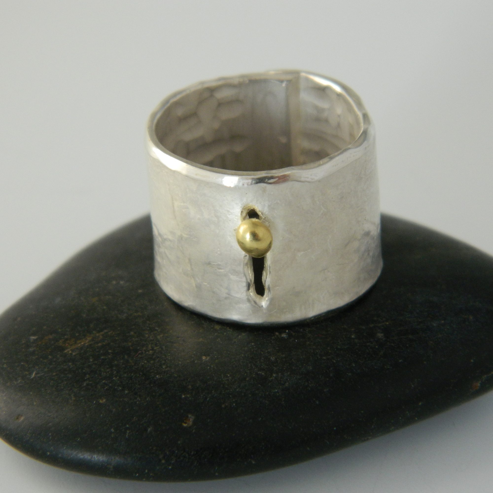 silver and gold yoni ring